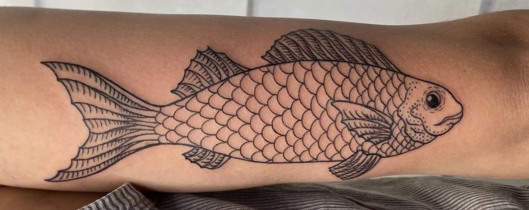 fish tattoo line work backside of upper arm